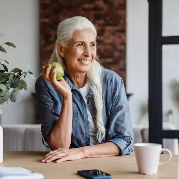 Photos of a lady about to eat an apple