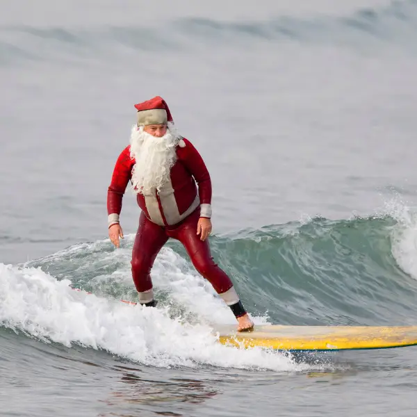 Santa surfing to the 44th annual seal beach christmas parade